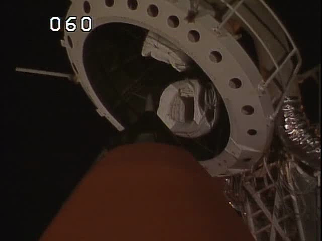 Close-up view ET nosecone and LOX tank forward ogive from a camera mounted on the water tower at 39A. The GOX Vent Hood is visible in the raised posit