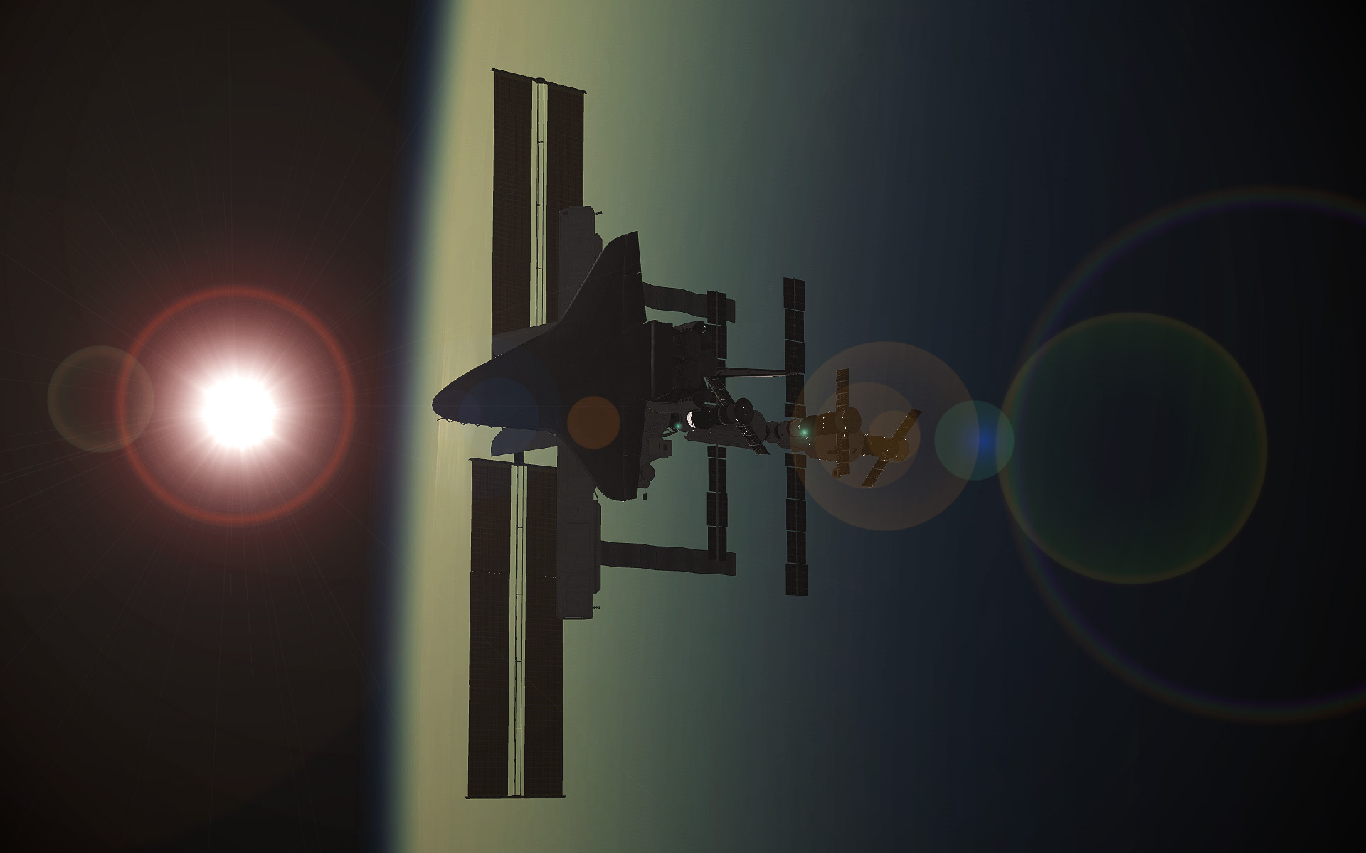 Discovery at ISS Sunset