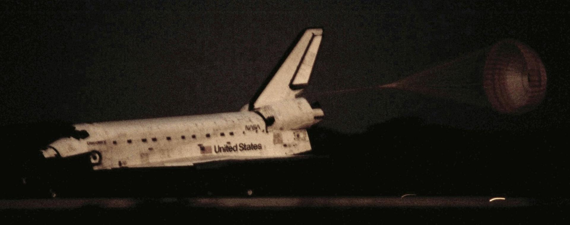Space shuttle landing from the VIP viewing site. It was before sunrise, hence the dark bits and the shaky background :).