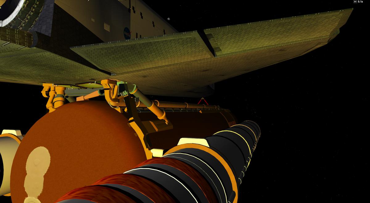 The yellow/orange glow of the SRB's and SSME's exhaust lights up the Orbiter's belly