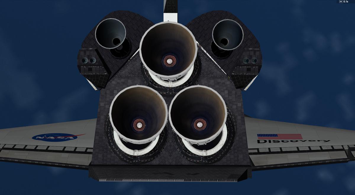 View of the tail section and the black TPS tiles layout around the SSME and the AFT RCS system
